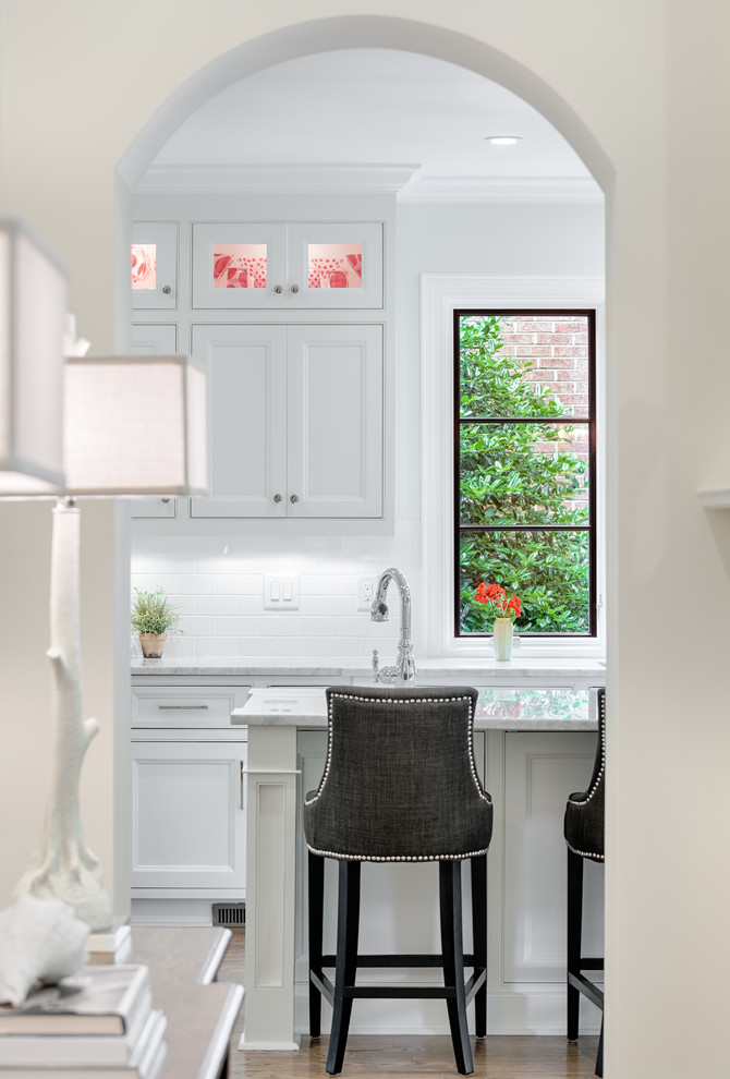 Inspiration for a timeless kitchen remodel in Charlotte with beaded inset cabinets, white backsplash and subway tile backsplash