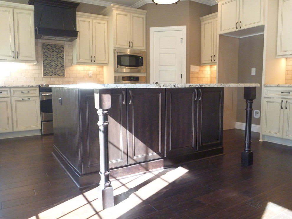 Example of a classic kitchen design in Atlanta with granite countertops and an island