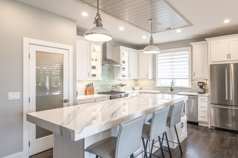Large minimalist l-shaped eat-in kitchen photo in Other with an undermount sink, shaker cabinets, white cabinets, quartz countertops, blue backsplash, glass tile backsplash, stainless steel appliances, an island and multicolored countertops