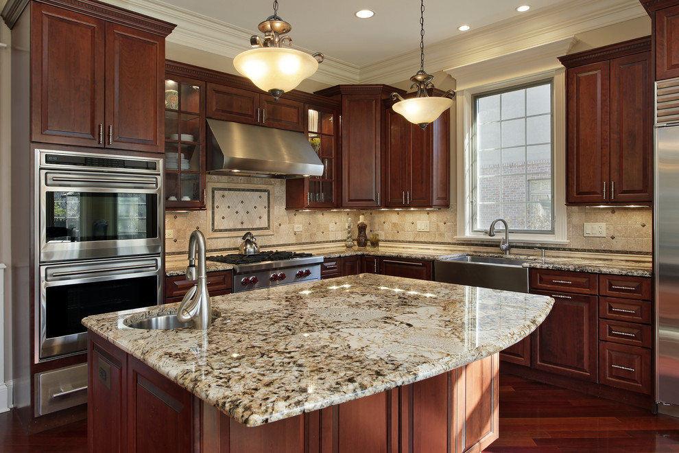Large elegant l-shaped medium tone wood floor and brown floor eat-in kitchen photo in Jacksonville with an undermount sink, shaker cabinets, white cabinets, quartzite countertops, beige backsplash, stainless steel appliances, an island, limestone backsplash and multicolored countertops