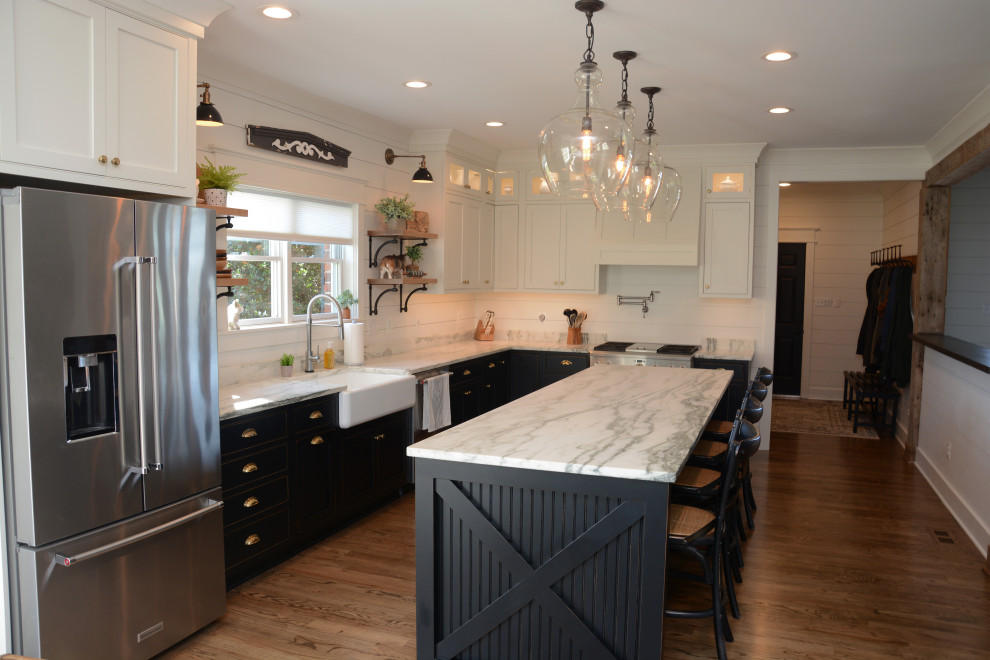 Eat-in kitchen - large farmhouse l-shaped dark wood floor and brown floor eat-in kitchen idea in DC Metro with a farmhouse sink, shaker cabinets, black cabinets, white backsplash, wood backsplash, stainless steel appliances, an island and white countertops