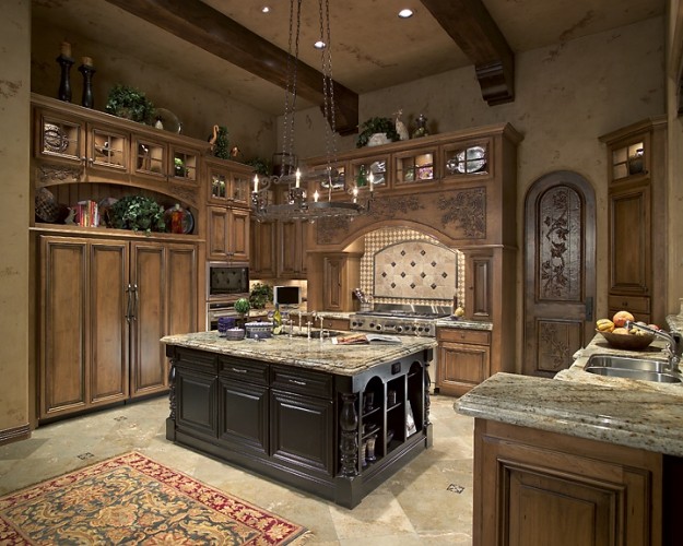 Esempio di un cucina con isola centrale tradizionale con lavello a doppia vasca, ante in legno scuro, top in granito, paraspruzzi multicolore e elettrodomestici in acciaio inossidabile