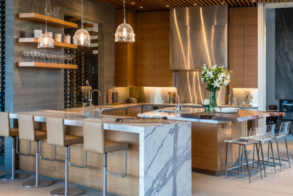 Inspiration for a mid-sized contemporary u-shaped porcelain tile and beige floor eat-in kitchen remodel in Los Angeles with an undermount sink, flat-panel cabinets, dark wood cabinets, marble countertops, metallic backsplash, metal backsplash, stainless steel appliances and an island