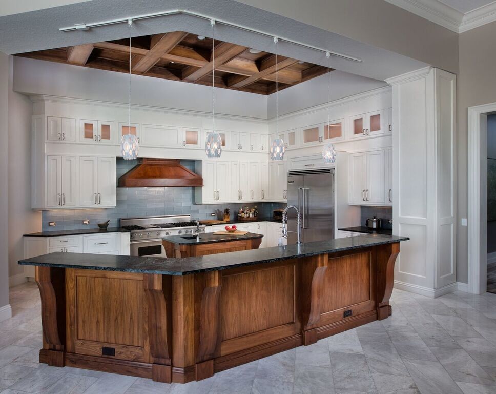 Inspiration for a large craftsman l-shaped marble floor and gray floor open concept kitchen remodel in Miami with shaker cabinets, white cabinets, soapstone countertops, gray backsplash, stainless steel appliances, two islands and subway tile backsplash
