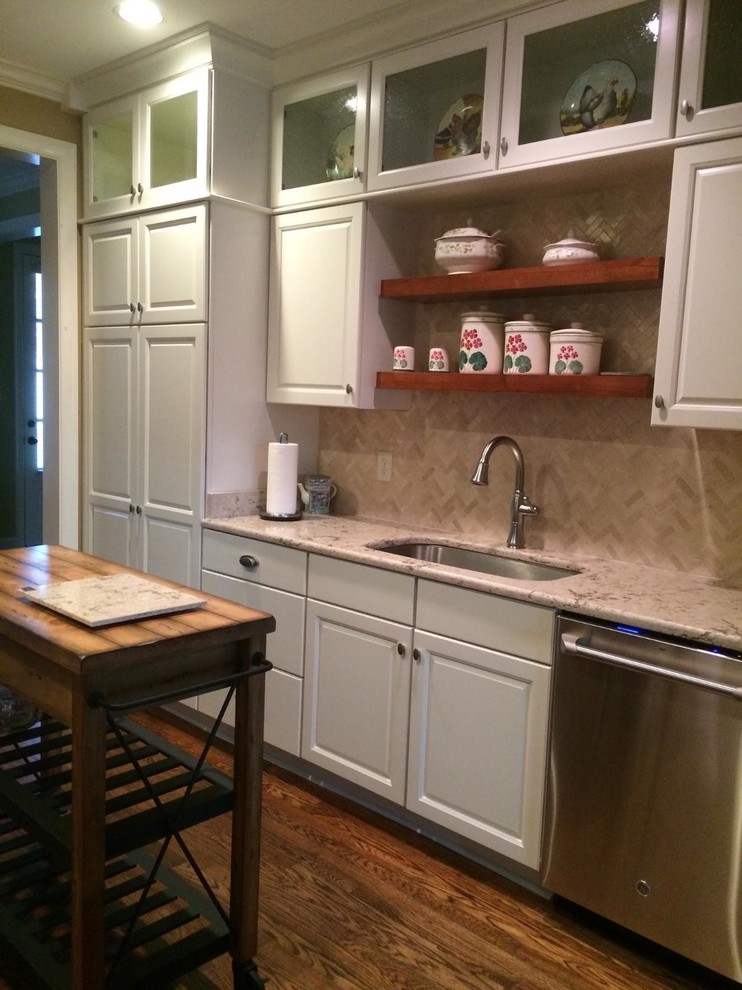 Example of a mid-sized classic galley light wood floor eat-in kitchen design in Other with raised-panel cabinets, white cabinets, quartz countertops, mosaic tile backsplash, stainless steel appliances and a single-bowl sink
