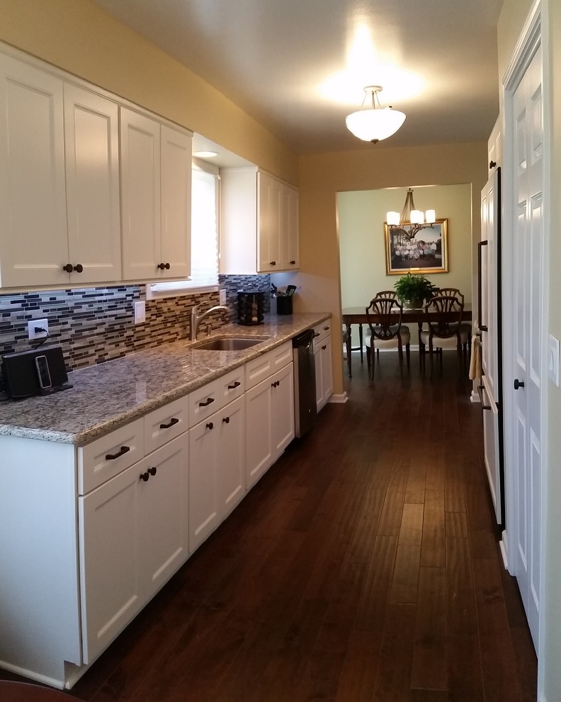 Galley Kitchen with Refaced White Cabinetry and New Wood Flooring ...