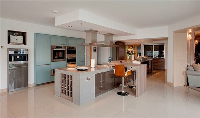 This is an example of an expansive contemporary open plan kitchen in Other with an island.
