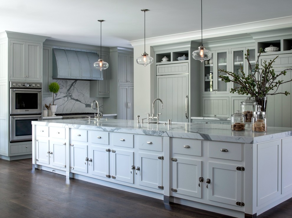 Example of a large farmhouse galley medium tone wood floor eat-in kitchen design in San Francisco with an undermount sink, shaker cabinets, blue cabinets, marble countertops, white backsplash, stone slab backsplash, stainless steel appliances and an island
