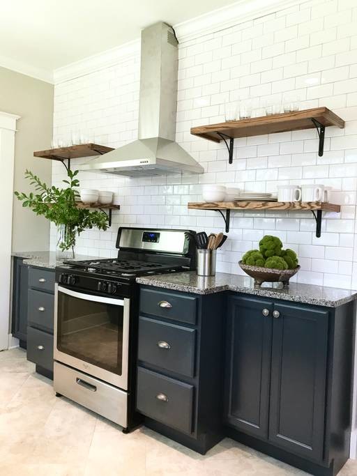 Example of a mid-sized country galley porcelain tile and gray floor eat-in kitchen design in Atlanta with an undermount sink, shaker cabinets, blue cabinets, granite countertops, white backsplash, ceramic backsplash and stainless steel appliances
