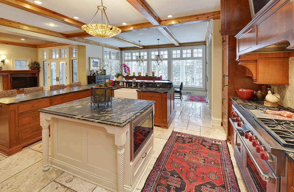 Inspiration for a mid-sized craftsman u-shaped travertine floor open concept kitchen remodel in Milwaukee with a farmhouse sink, recessed-panel cabinets, medium tone wood cabinets, marble countertops, beige backsplash, stainless steel appliances and an island