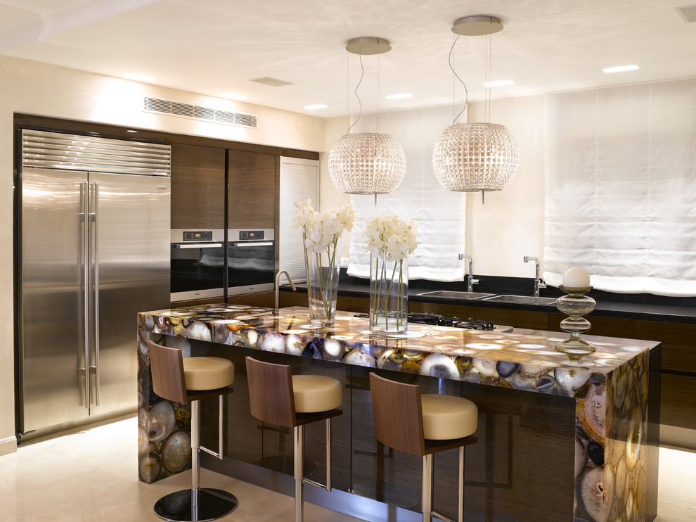 Trendy kitchen photo in Dallas with stainless steel appliances and multicolored countertops