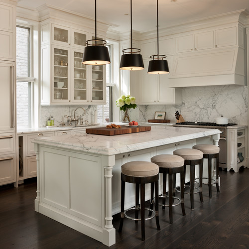Bright white shaker kitchen with marble island and stools — inspiration for Kitchen & Bathroom Cabinets for Singles.