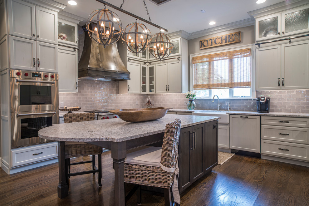 Enclosed kitchen - mid-sized country l-shaped dark wood floor and brown floor enclosed kitchen idea in Other with a farmhouse sink, shaker cabinets, gray cabinets, granite countertops, gray backsplash, subway tile backsplash, stainless steel appliances and an island