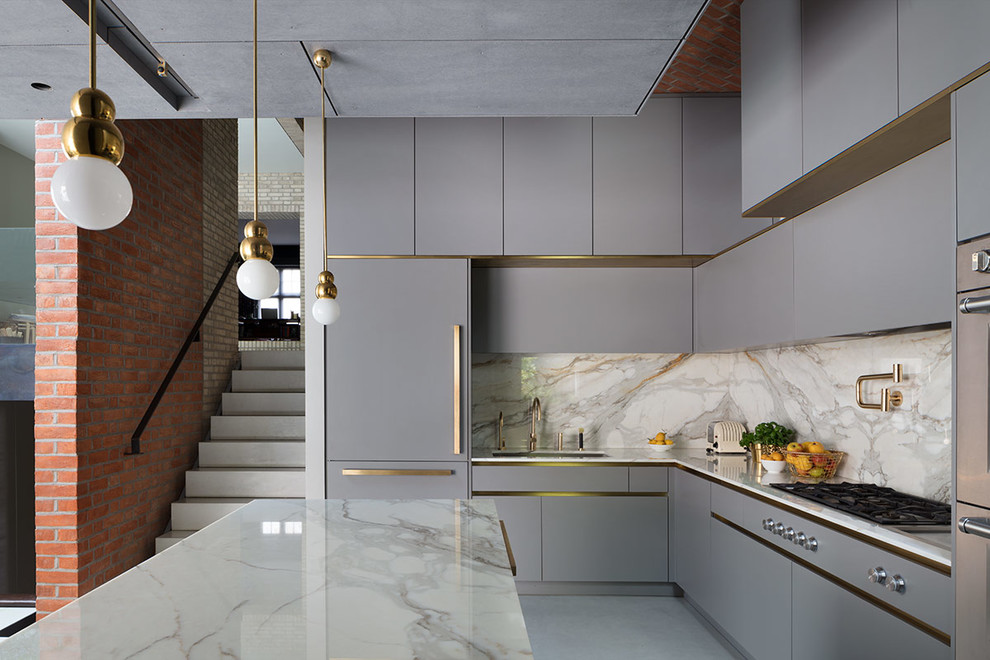 Inspiration for a large contemporary l-shaped open plan kitchen in London with a submerged sink, flat-panel cabinets, grey cabinets, marble worktops, white splashback, marble splashback, stainless steel appliances, concrete flooring, an island, grey floors and white worktops.