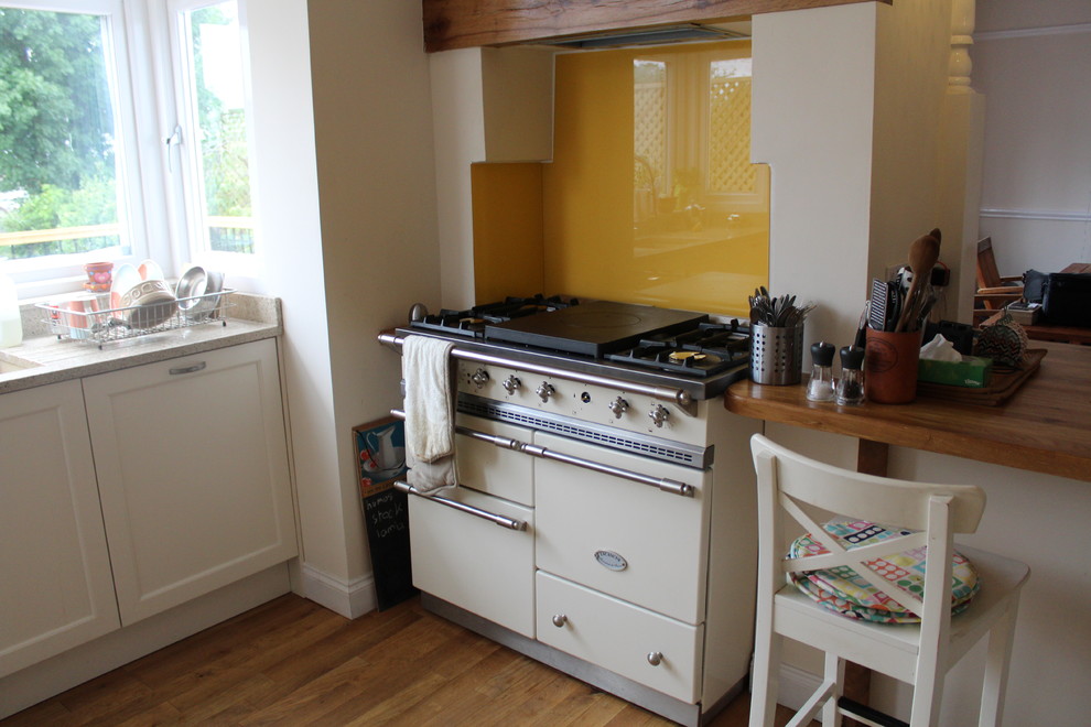 Mid-sized elegant kitchen photo in London