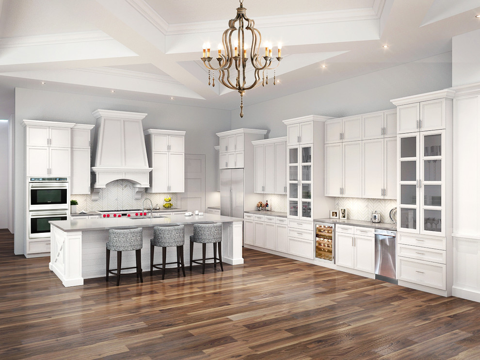 Example of a large transitional l-shaped medium tone wood floor eat-in kitchen design in Phoenix with an undermount sink, shaker cabinets, white cabinets, quartzite countertops, white backsplash, subway tile backsplash, stainless steel appliances and an island