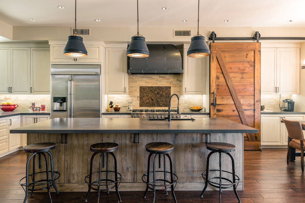 Eat-in kitchen - cottage l-shaped dark wood floor eat-in kitchen idea in Phoenix with an undermount sink, raised-panel cabinets, beige cabinets, stainless steel appliances and an island