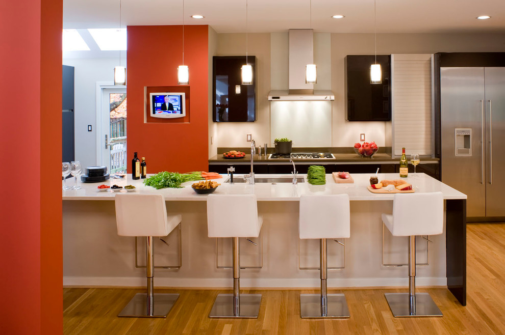 Example of a trendy kitchen design in DC Metro with stainless steel appliances