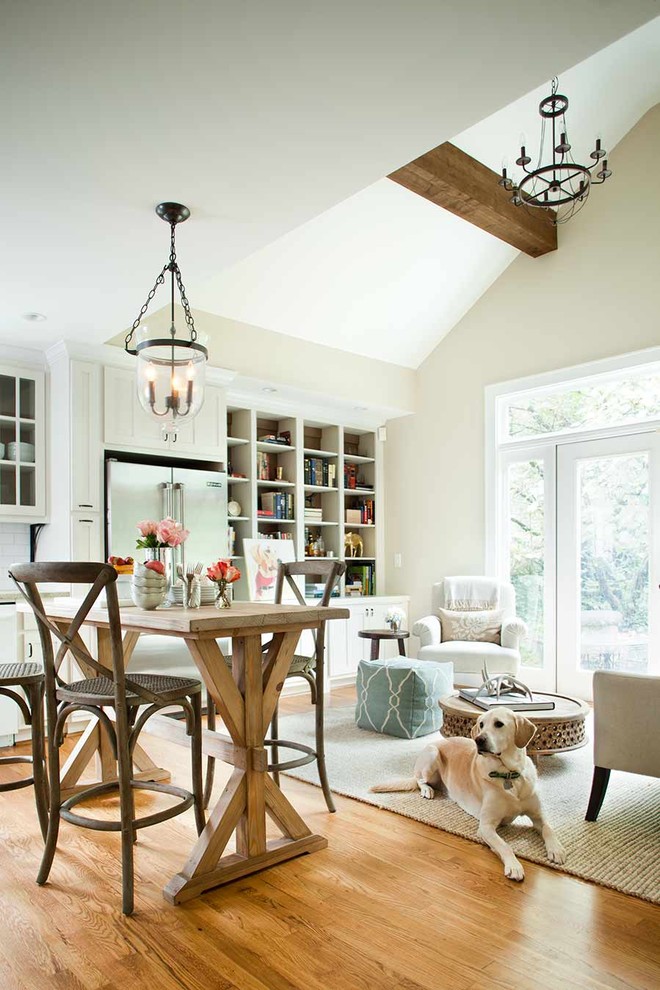 Small mountain style l-shaped light wood floor enclosed kitchen photo in Atlanta with stainless steel appliances, an undermount sink, shaker cabinets, white cabinets, granite countertops, white backsplash and subway tile backsplash