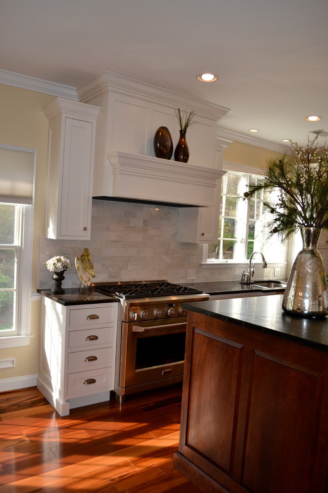 Example of a classic galley eat-in kitchen design in Baltimore with an undermount sink, beaded inset cabinets and white cabinets