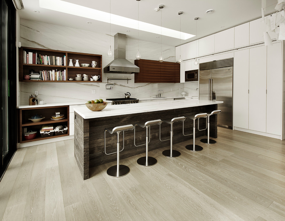 Inspiration for a contemporary l-shaped kitchen in Toronto with a submerged sink, open cabinets, medium wood cabinets, white splashback, stainless steel appliances, light hardwood flooring, an island and stone slab splashback.
