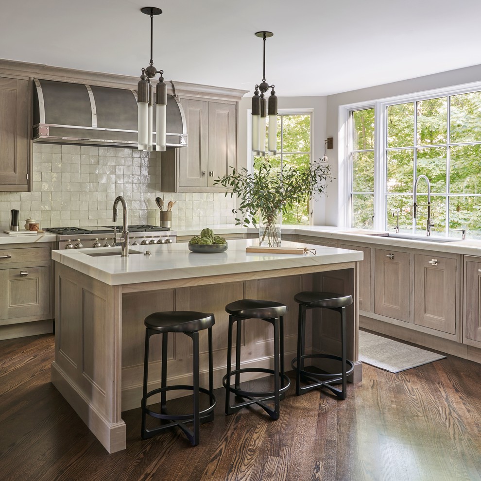 Inspiration for a transitional u-shaped dark wood floor and brown floor kitchen remodel in Chicago with an undermount sink, beaded inset cabinets, beige cabinets, an island and gray countertops