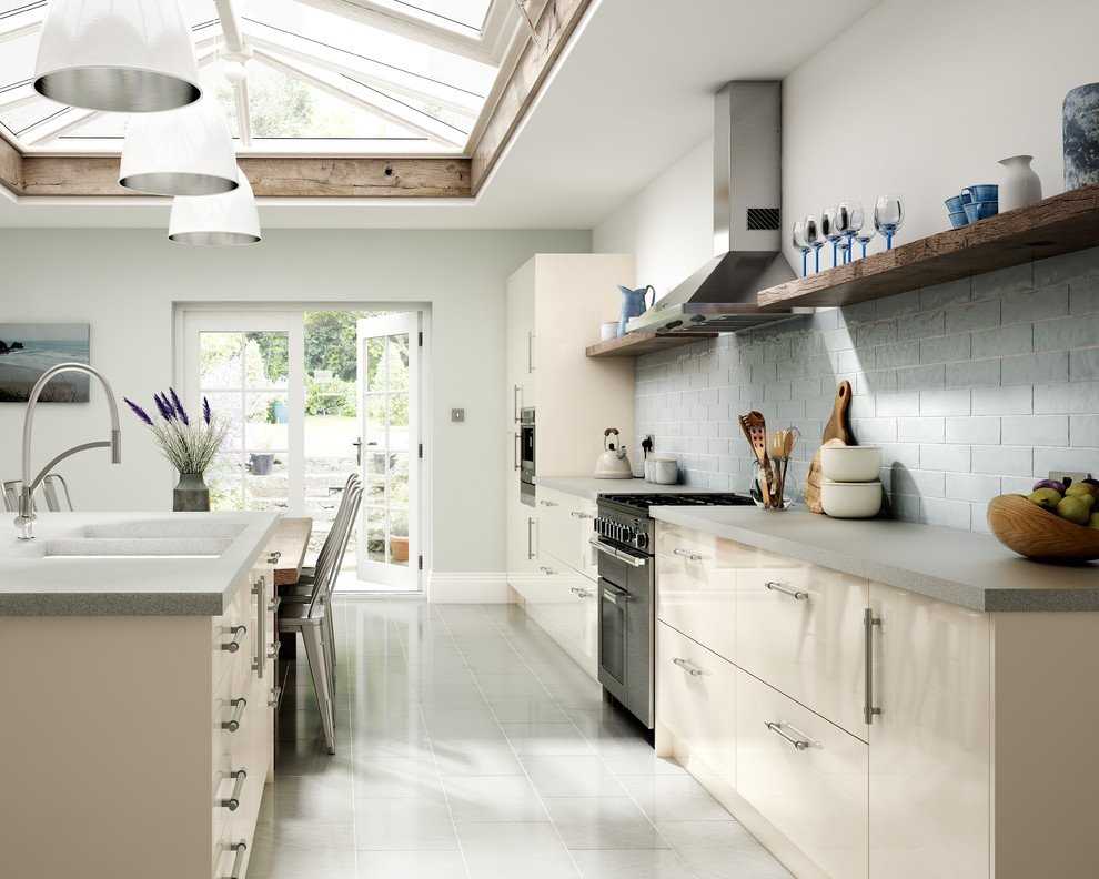 Inspiration for a large classic grey and cream single-wall kitchen/diner in Other with a double-bowl sink, flat-panel cabinets, beige cabinets, laminate countertops, blue splashback, metro tiled splashback, coloured appliances, porcelain flooring, an island and white floors.