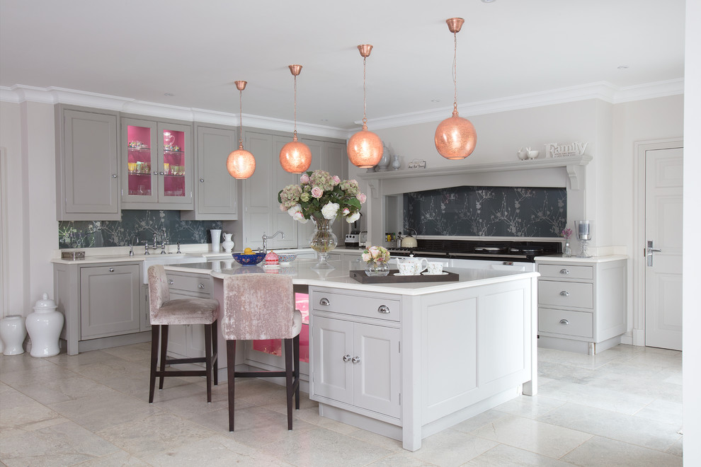 Photo of a medium sized classic grey and pink l-shaped enclosed kitchen in Surrey with beaded cabinets, grey cabinets, grey splashback, an island, grey floors, white worktops, limestone worktops and black appliances.