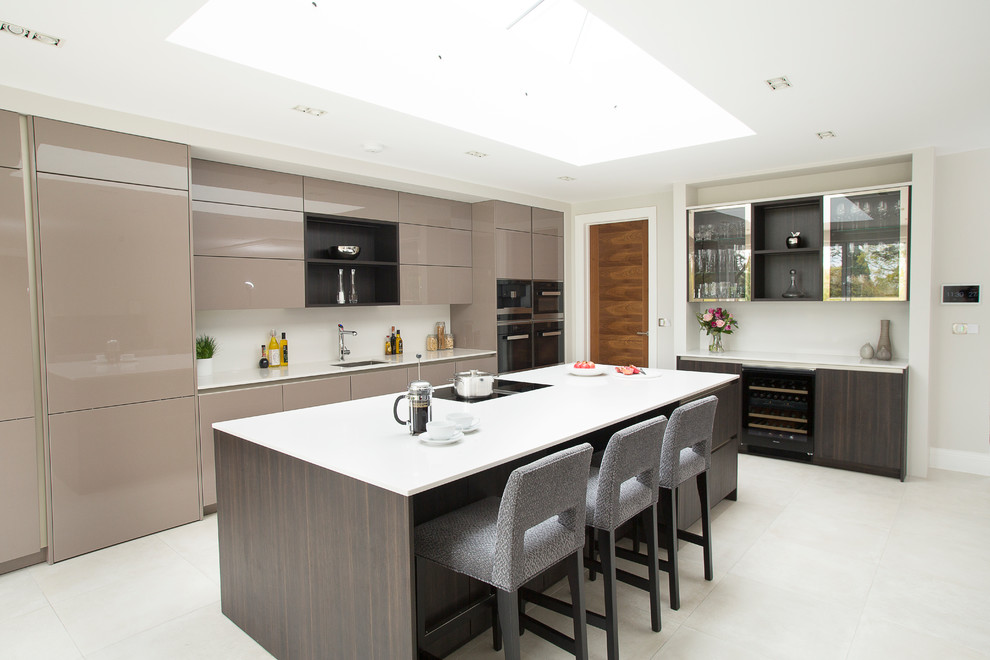 Design ideas for a contemporary l-shaped kitchen in Kent with a submerged sink, flat-panel cabinets, brown cabinets, an island and white floors.