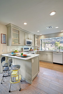 Closeup of classic cream-colored kitchen with appliances Stock Photo by  staRRush