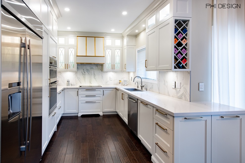 Photo of a small classic u-shaped kitchen/diner in Toronto with a double-bowl sink, shaker cabinets, white cabinets, engineered stone countertops, white splashback, porcelain splashback, stainless steel appliances, dark hardwood flooring, a breakfast bar, brown floors and white worktops.