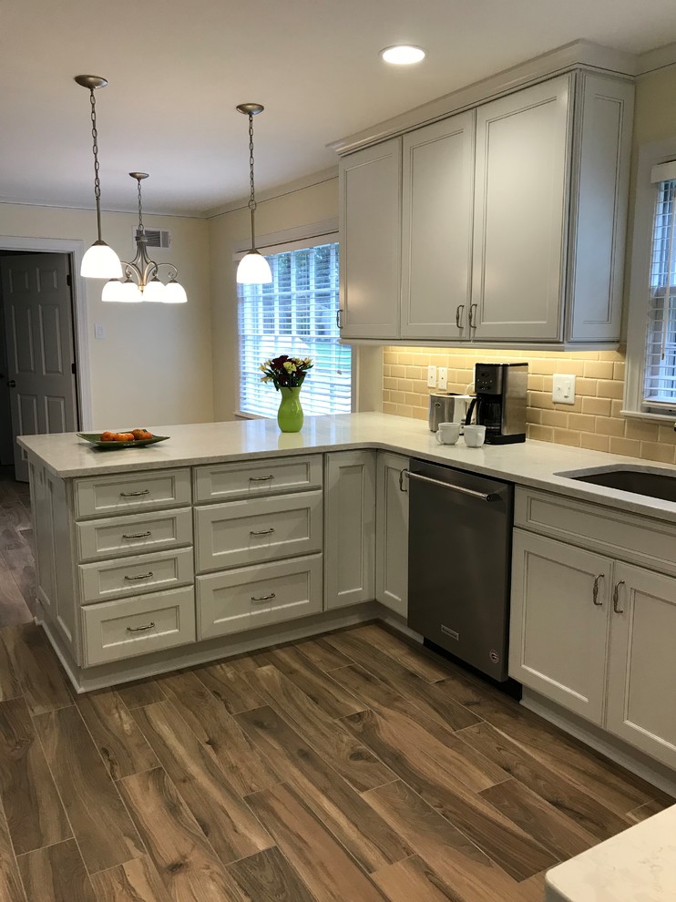 Eat-in kitchen - mid-sized transitional galley porcelain tile and beige floor eat-in kitchen idea in Other with an undermount sink, recessed-panel cabinets, white cabinets, quartz countertops, beige backsplash, ceramic backsplash, stainless steel appliances, no island and white countertops