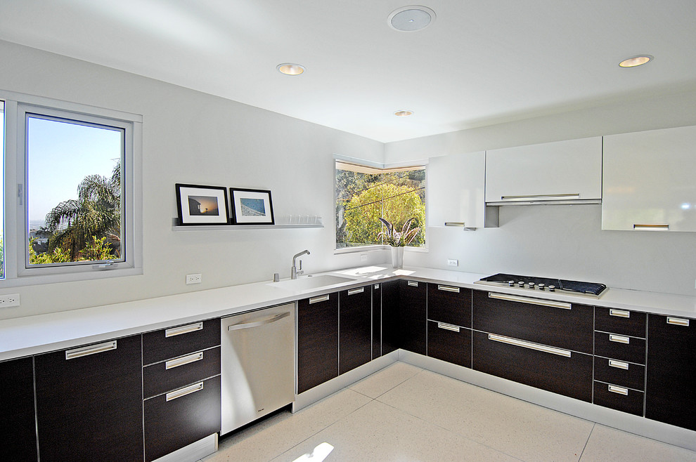 Modern kitchen in Los Angeles with flat-panel cabinets and stainless steel appliances.