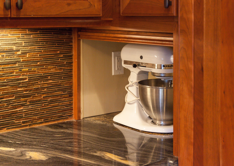 Example of a large mountain style u-shaped open concept kitchen design in Denver with beaded inset cabinets, distressed cabinets, granite countertops, multicolored backsplash, glass tile backsplash and an island