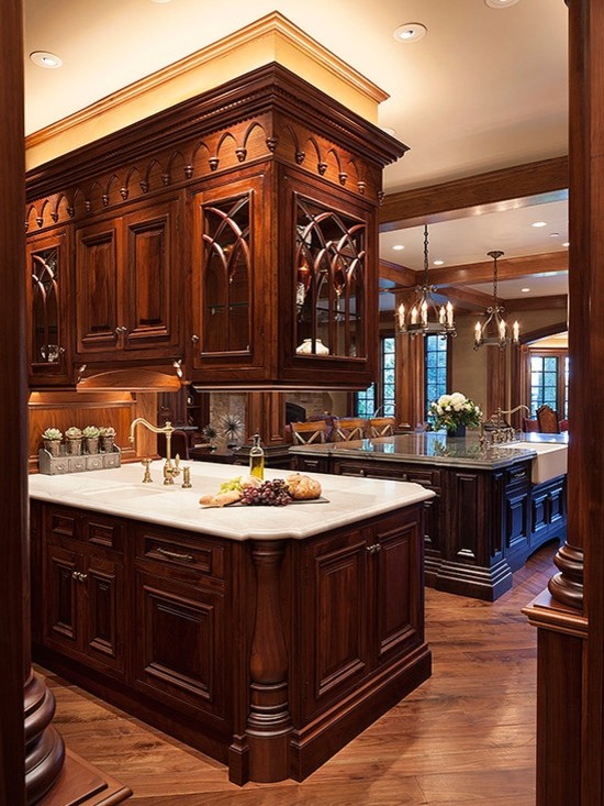 Inspiration for a large timeless open concept kitchen remodel in Manchester with beaded inset cabinets, dark wood cabinets, marble countertops and two islands