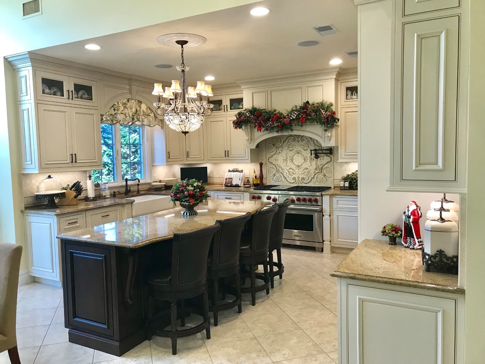 Example of a large classic l-shaped porcelain tile and beige floor eat-in kitchen design in New York with a farmhouse sink, beaded inset cabinets, white cabinets, granite countertops, white backsplash, marble backsplash, stainless steel appliances and an island