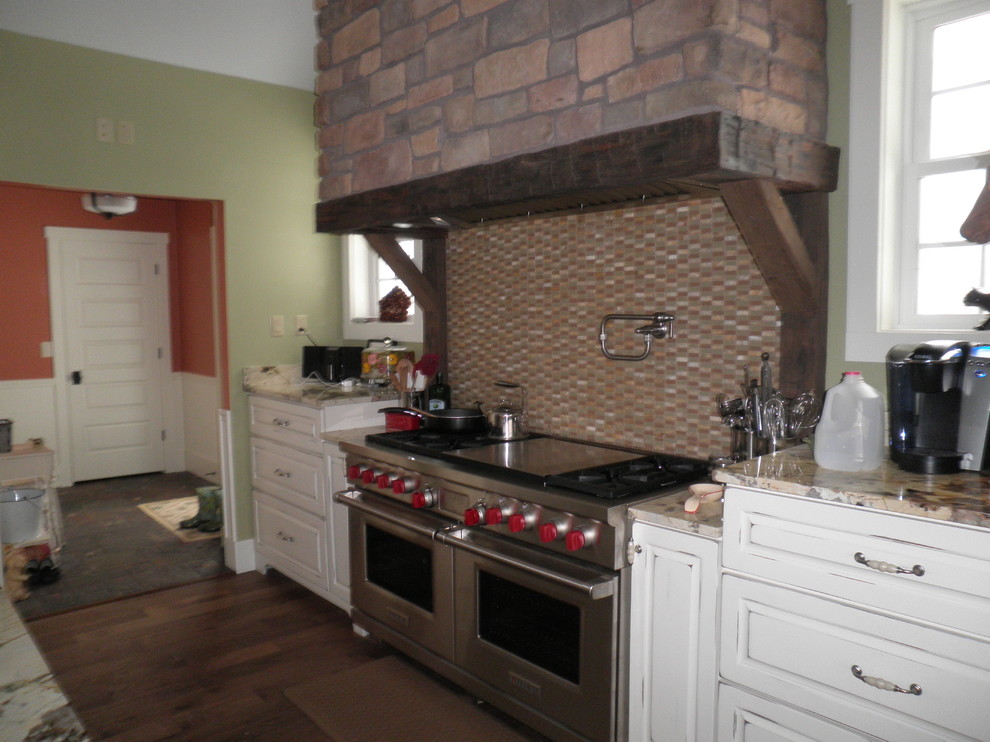 Large country kitchen/diner in Other with a belfast sink, granite worktops and multiple islands.