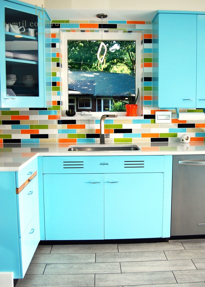 Inspiration for a large 1960s u-shaped ceramic tile and gray floor eat-in kitchen remodel in St Louis with a double-bowl sink, flat-panel cabinets, blue cabinets, multicolored backsplash and stainless steel appliances