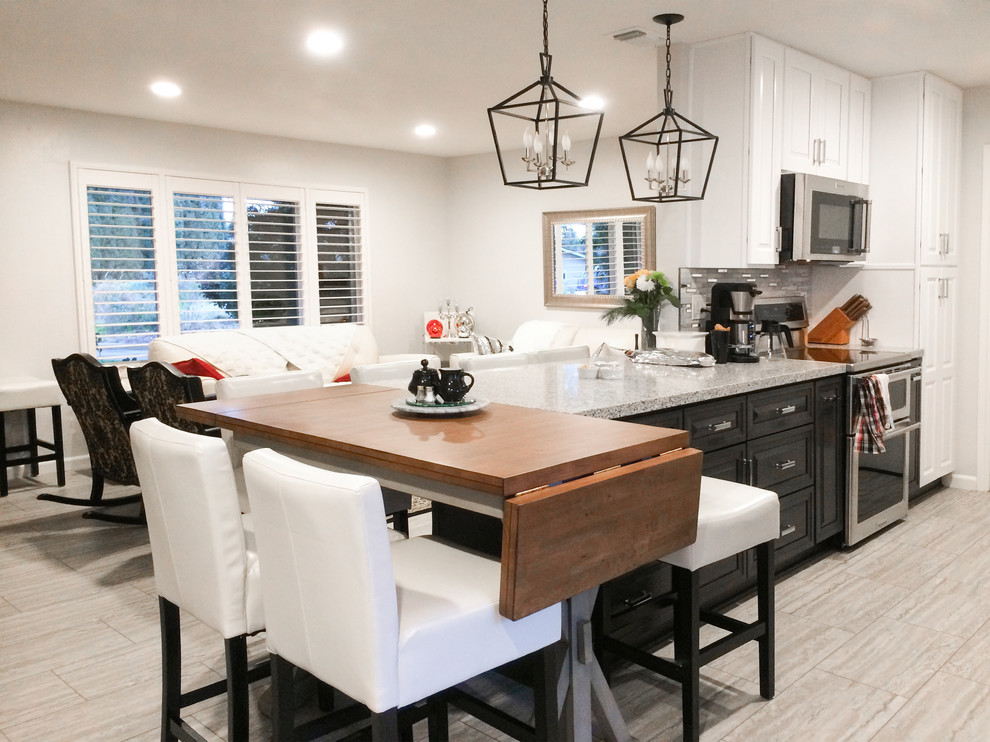 Example of a small trendy galley porcelain tile and beige floor eat-in kitchen design in Sacramento with an undermount sink, raised-panel cabinets, white cabinets, metallic backsplash, matchstick tile backsplash, stainless steel appliances, a peninsula and gray countertops