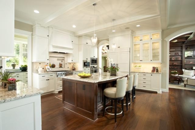 Eat-in kitchen - transitional u-shaped eat-in kitchen idea in Minneapolis with an undermount sink, flat-panel cabinets, white cabinets, granite countertops, white backsplash, ceramic backsplash and stainless steel appliances