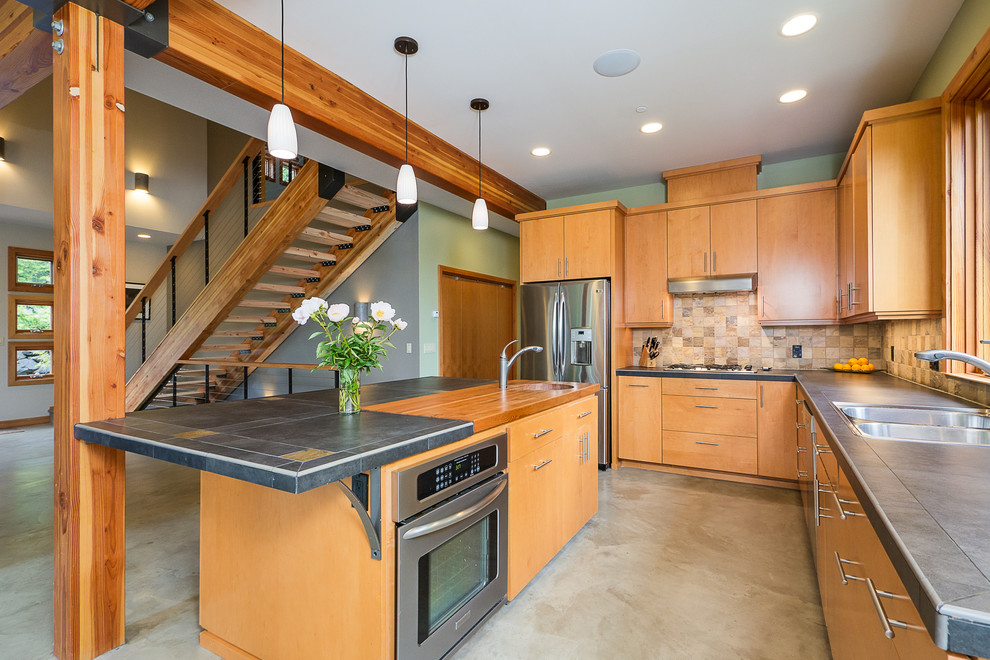 Example of a trendy kitchen design in Seattle with wood countertops