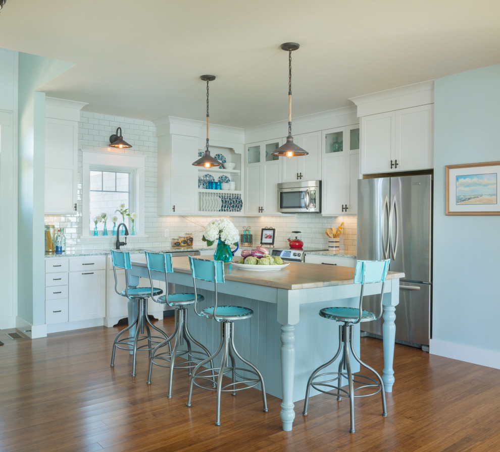 Beach style l-shaped open concept kitchen photo in Providence with shaker cabinets, white cabinets, quartz countertops, white backsplash, stainless steel appliances and subway tile backsplash