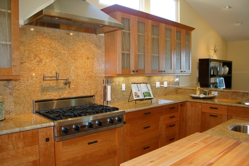 Example of a trendy u-shaped bamboo floor kitchen design in San Francisco with a single-bowl sink, shaker cabinets, medium tone wood cabinets, granite countertops, multicolored backsplash, stone slab backsplash and stainless steel appliances
