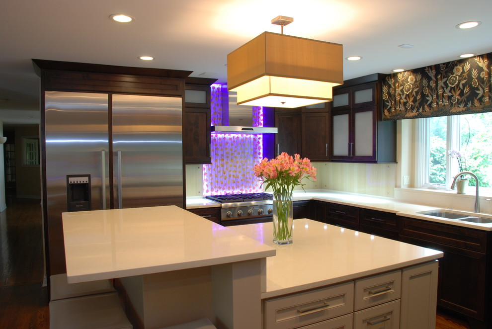 Example of a large zen u-shaped medium tone wood floor eat-in kitchen design in Chicago with flat-panel cabinets, dark wood cabinets, quartz countertops, stainless steel appliances and an island