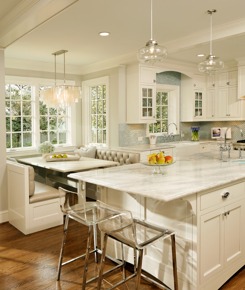 Elegant kitchen photo in DC Metro with mosaic tile backsplash, quartzite countertops, a farmhouse sink, recessed-panel cabinets, white cabinets, blue backsplash and white countertops