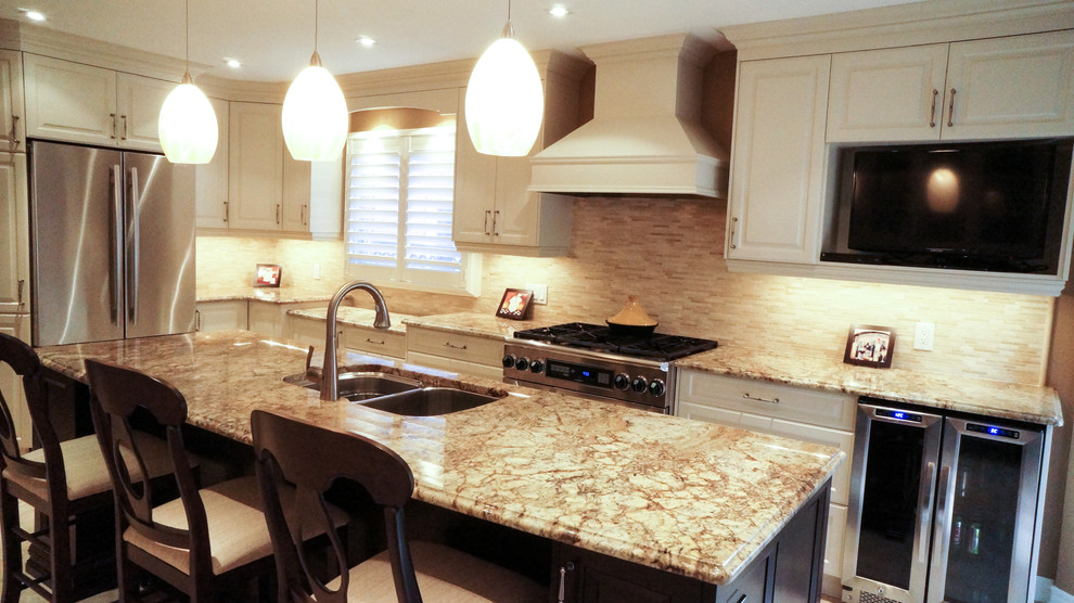 Large elegant u-shaped kitchen photo in Toronto with an undermount sink, raised-panel cabinets, white cabinets, granite countertops, beige backsplash, stainless steel appliances and an island