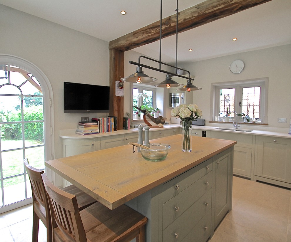 Inspiration for a large rural u-shaped kitchen/diner in Berkshire with a built-in sink, shaker cabinets, grey cabinets, quartz worktops, grey splashback, glass sheet splashback, stainless steel appliances, limestone flooring and an island.