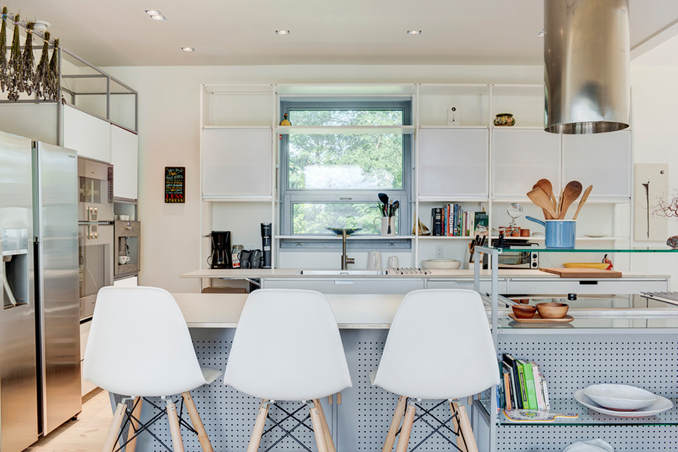 Inspiration for a mid-sized modern l-shaped open concept kitchen remodel in New York with flat-panel cabinets, white cabinets and an island
