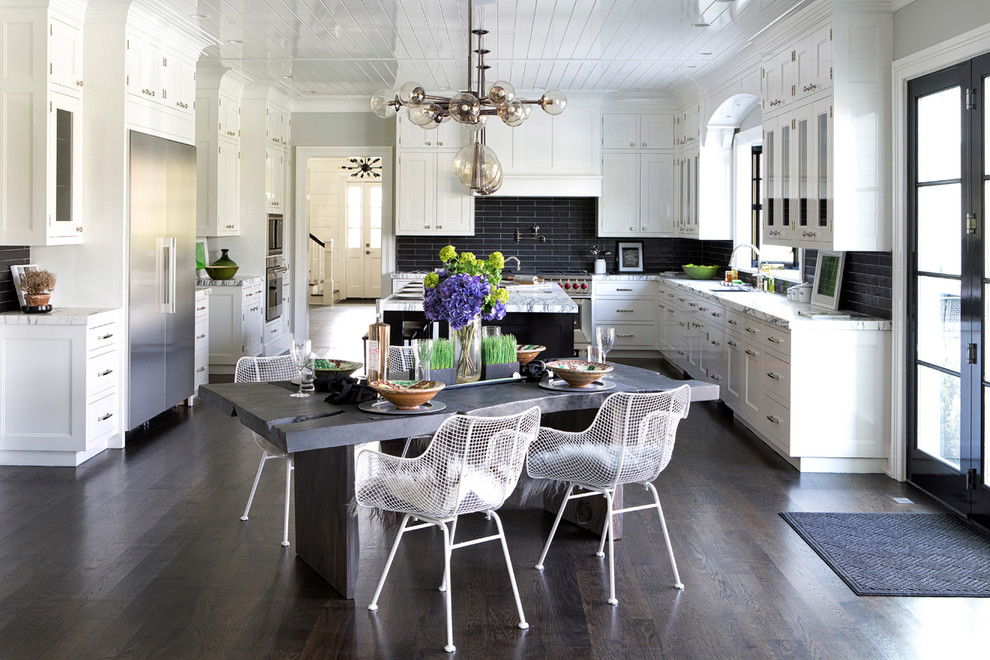 Eat-in kitchen - large transitional l-shaped dark wood floor eat-in kitchen idea in New York with an undermount sink, shaker cabinets, marble countertops, black backsplash, ceramic backsplash, stainless steel appliances and an island