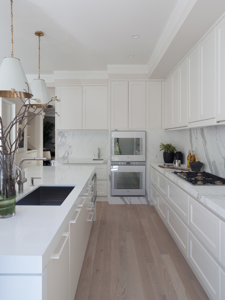 Contemporary kitchen in San Francisco with shaker cabinets, white cabinets and white appliances.